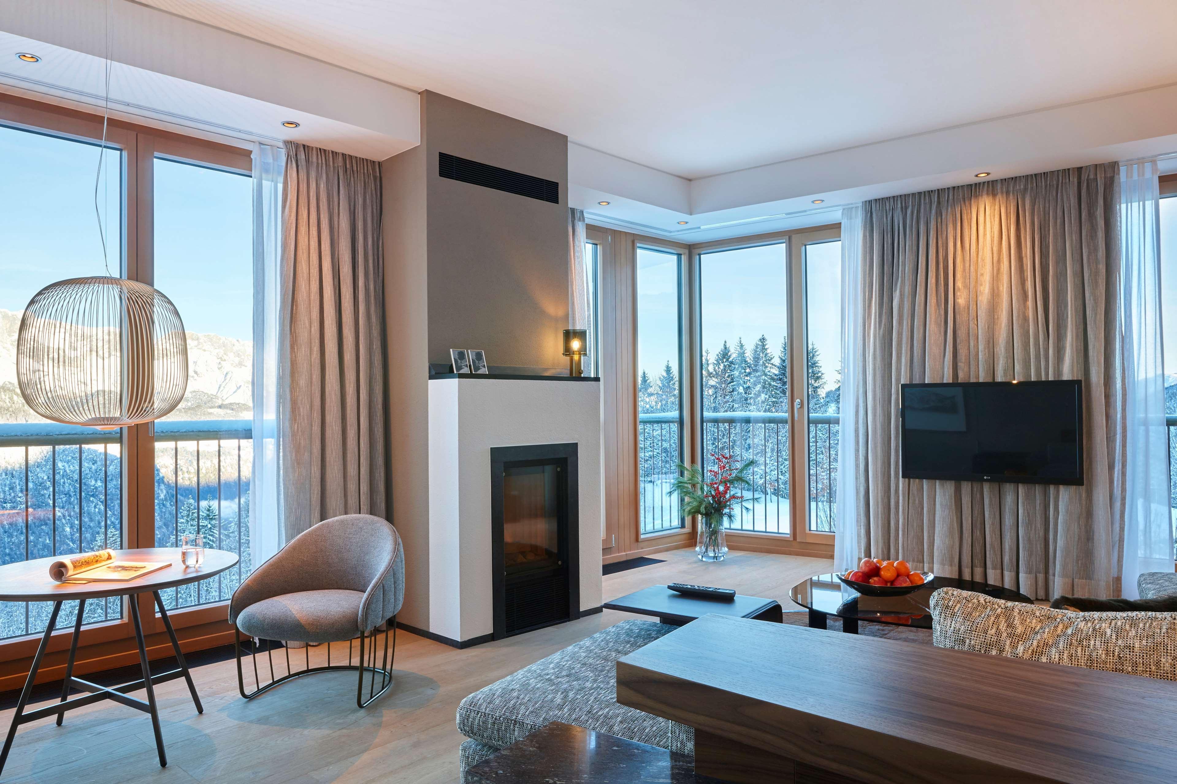 Kempinski Hotel Berchtesgaden Exterior foto A living room with a fireplace